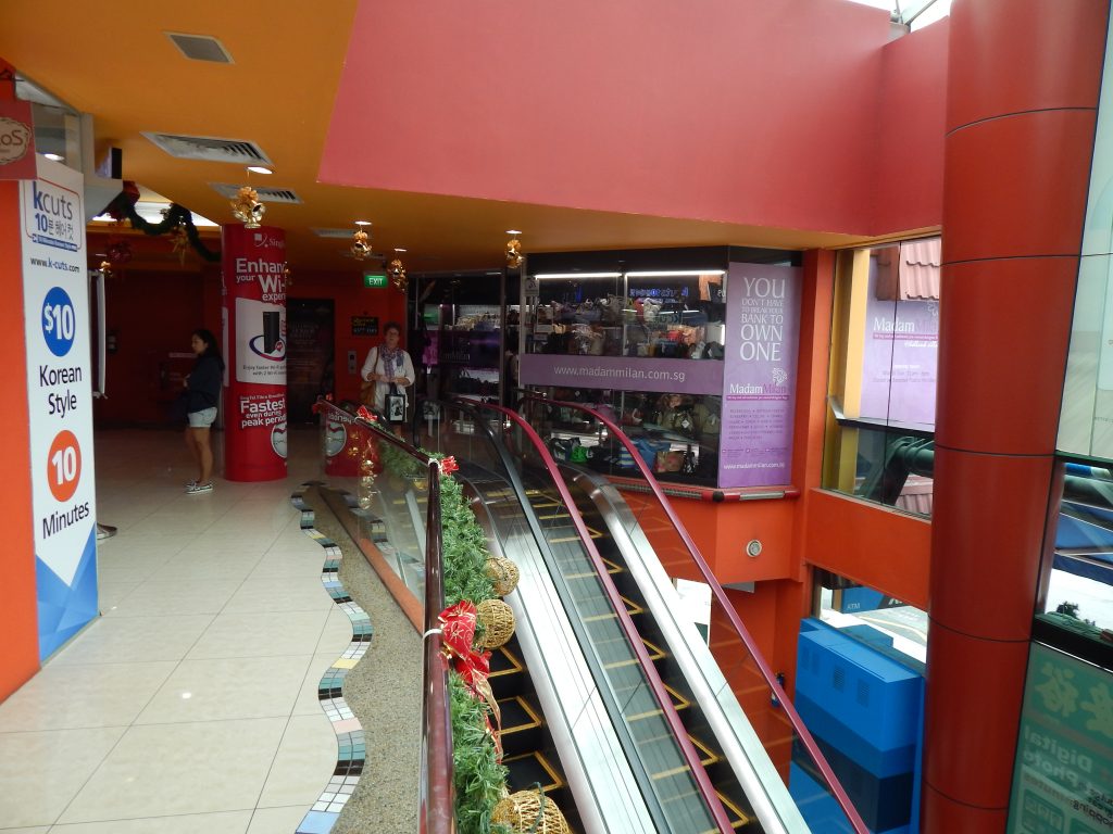 Escalator inside mall, Holland Village, Singapore