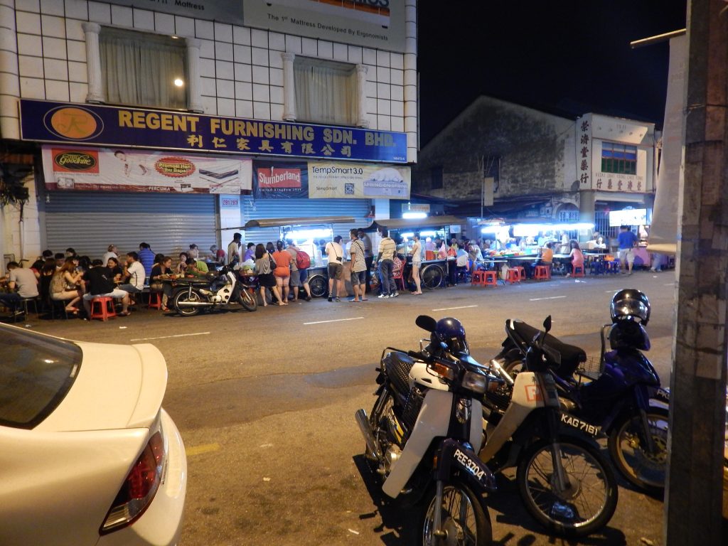 Many mopeds lined up in the streets of Penang