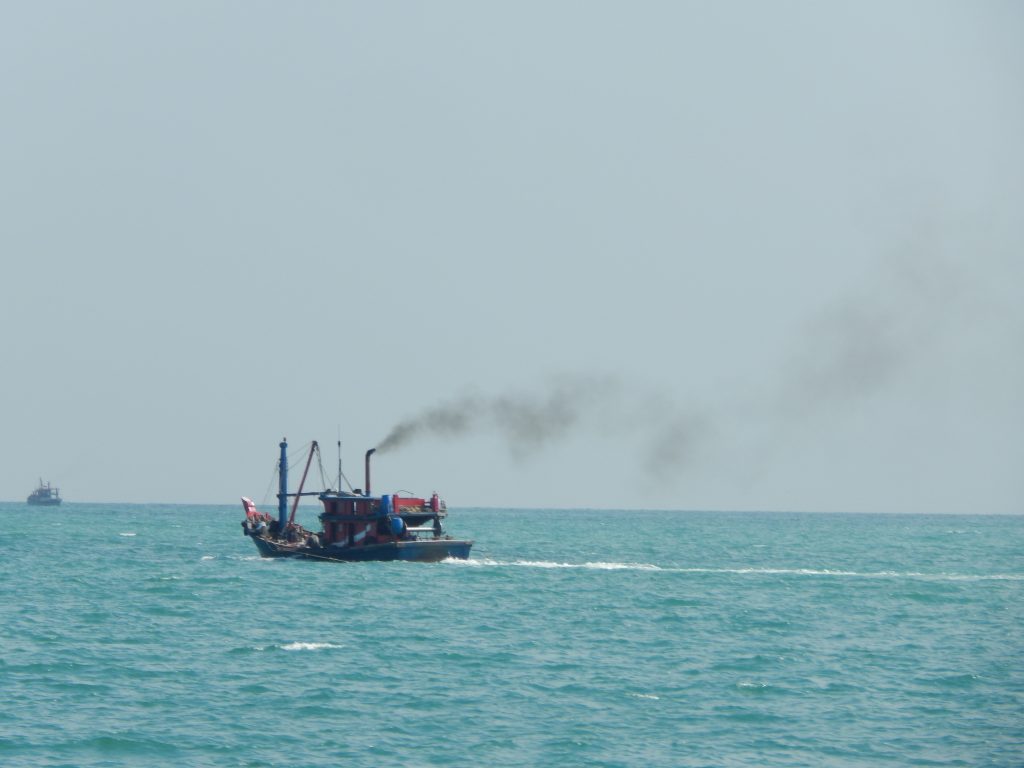 A small steamboat on the strait of Malacca