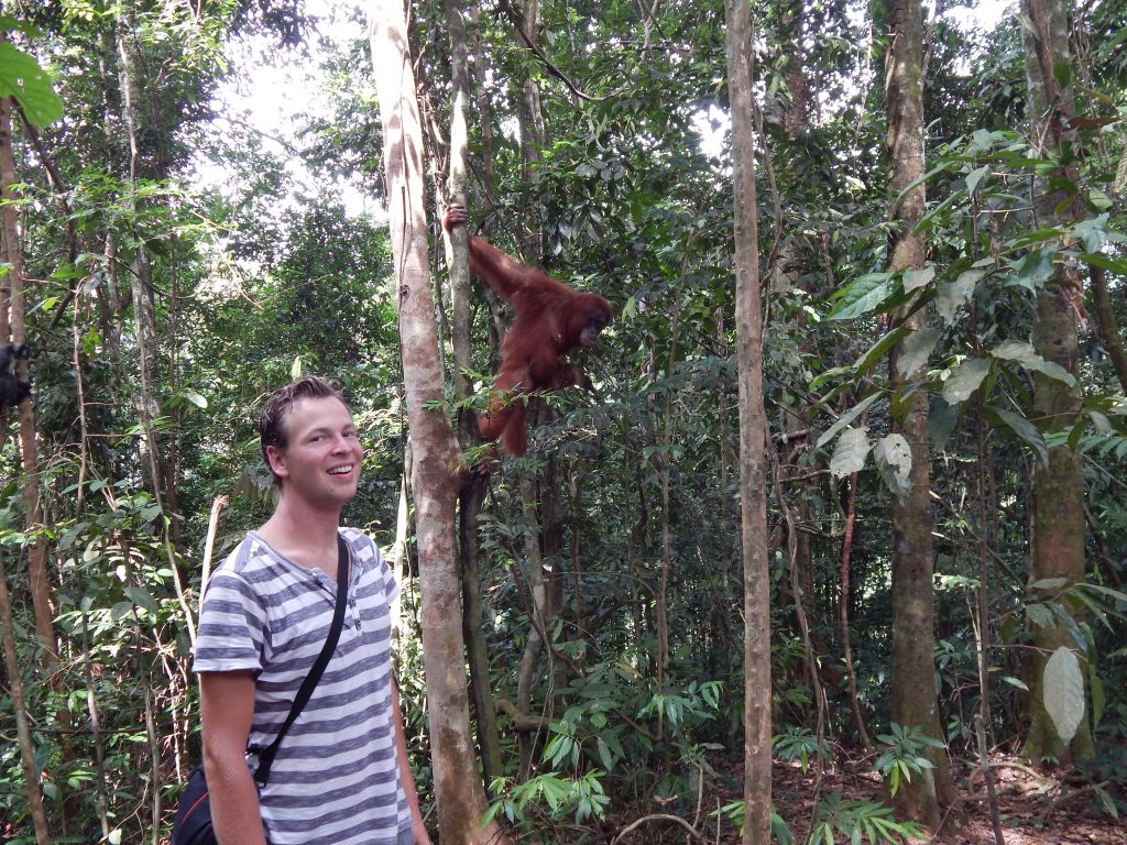 Me in front of the orangutan in Bukit Lawang's jungle