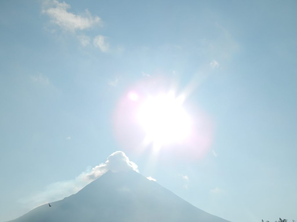 Sun above the summit of Gunung Merapi