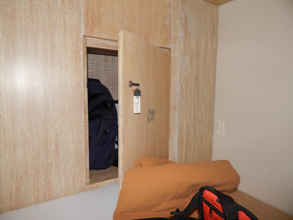 Locker next to bed in Rumah Kayu hostel