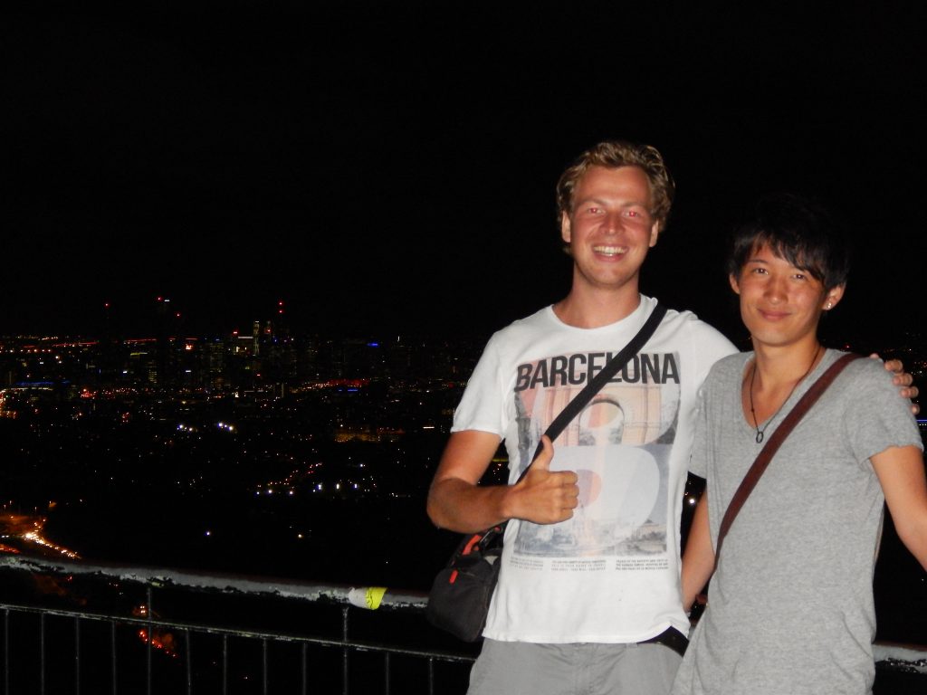 Toshi and Maarten in front of the view of Brisbane