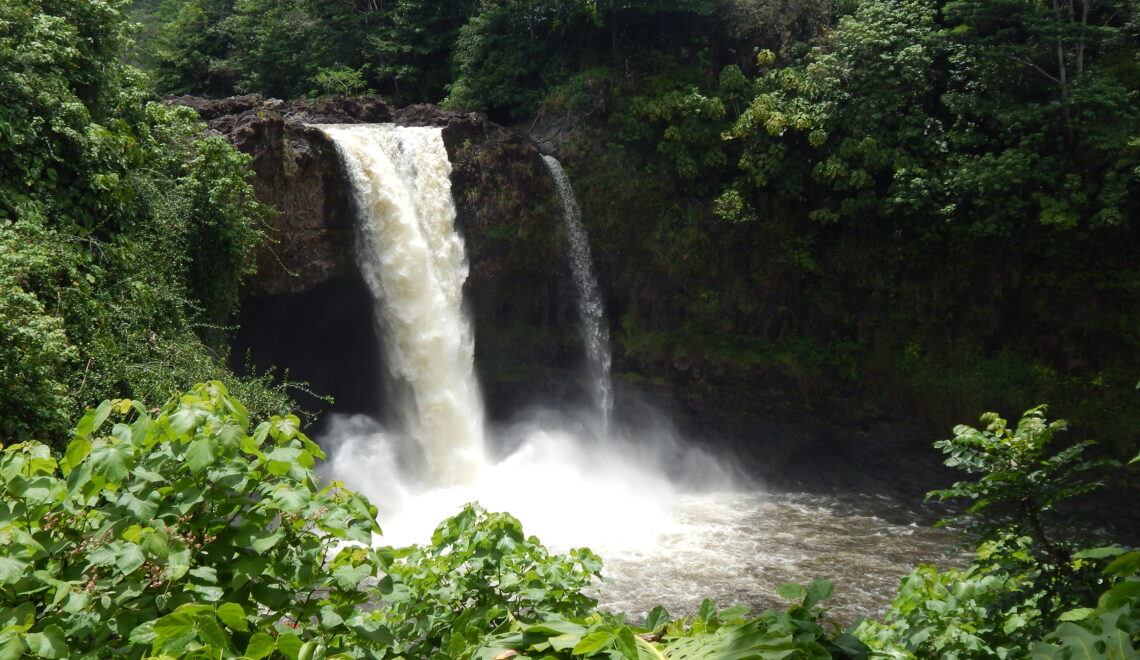 A beautiful waterfall surrounded by green nature, Rainbow Falls, the Big Island Hawaii